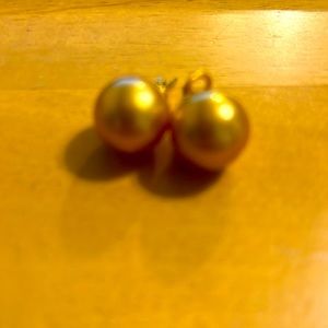 Deep golden south sea pearl in yello gold setting